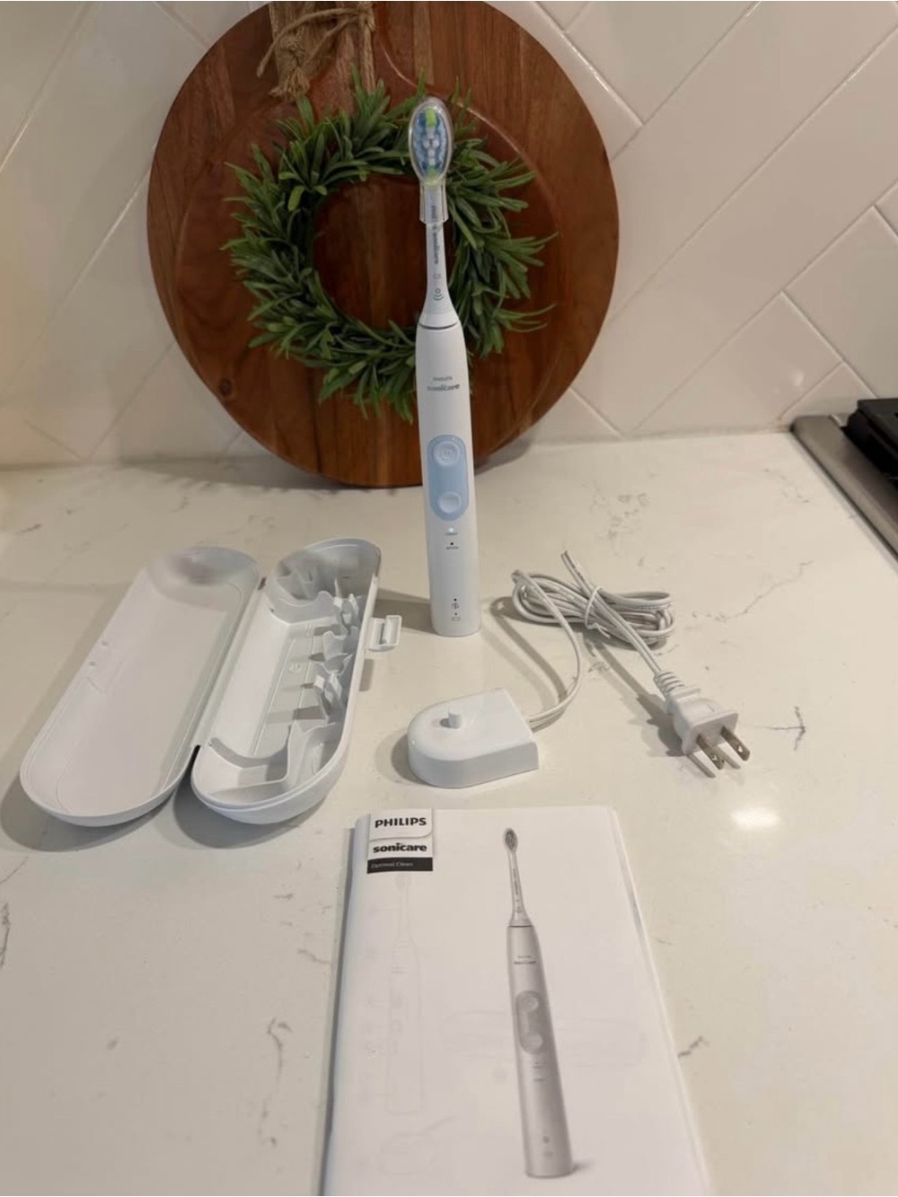 Sonic Care Toothbrush with travel case and charger.